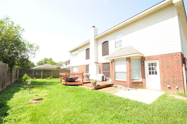 2631 Plantation Hollow Ct, Missouri City, TX 77459 - rear view of property with brick siding, a chimney, and a deck