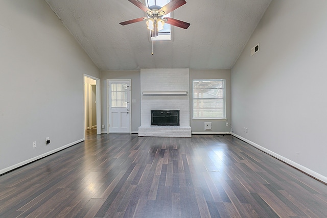 unfurnished living room featuring vaulted ceiling, a ceiling fan, visible vents, and a healthy amount of sunlight