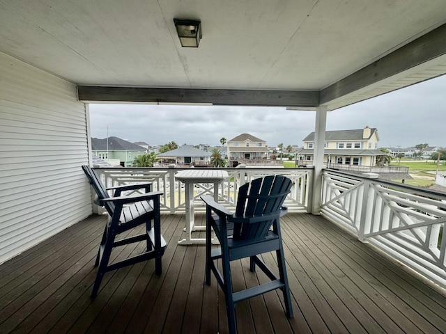 wooden deck with a residential view