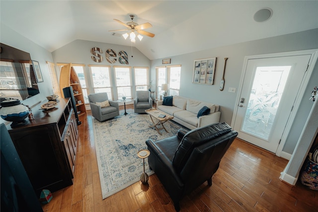 living area with vaulted ceiling, ceiling fan, and hardwood / wood-style floors