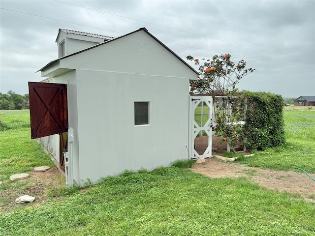 view of property exterior featuring a yard