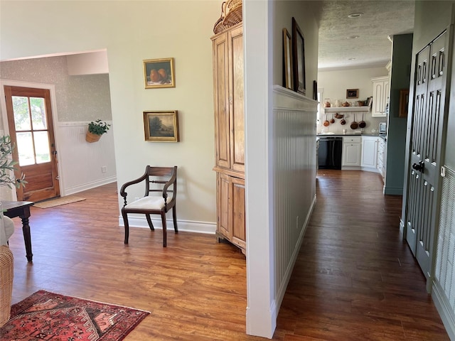 corridor with dark wood-style floors