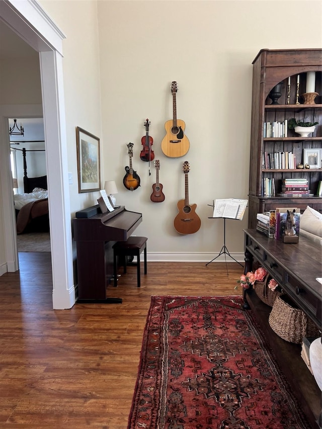 interior space featuring baseboards and wood finished floors