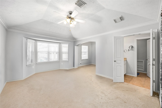2634 Couch St, Houston, TX 77008 - unfurnished bedroom with light colored carpet, arched walkways, vaulted ceiling, and visible vents