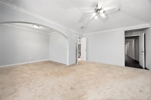 2634 Couch St, Houston, TX 77008 - interior space featuring carpet, lofted ceiling, visible vents, arched walkways, and crown molding