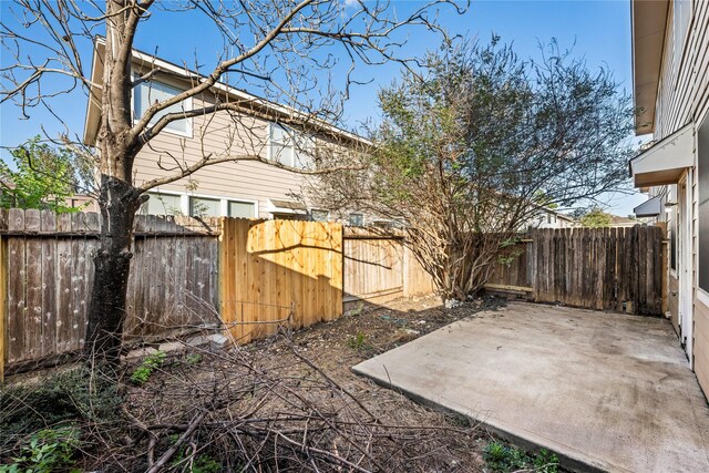 16854 Carrollton Creek Ln, Houston, TX 77084 - view of yard with a fenced backyard and a patio