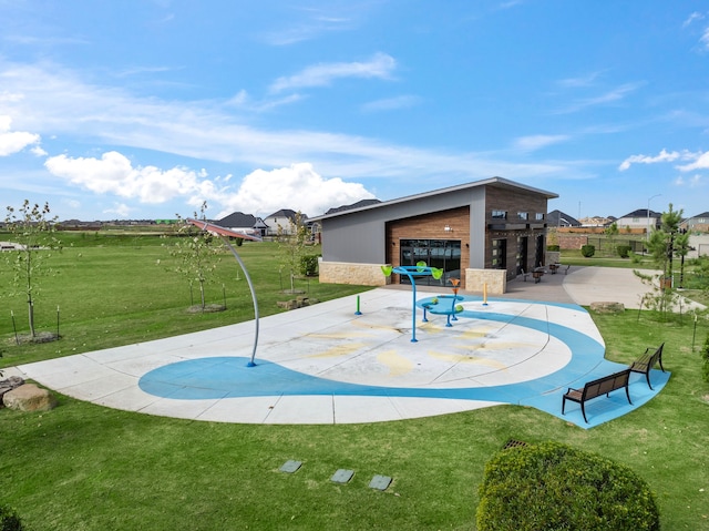 view of jungle gym with a lawn