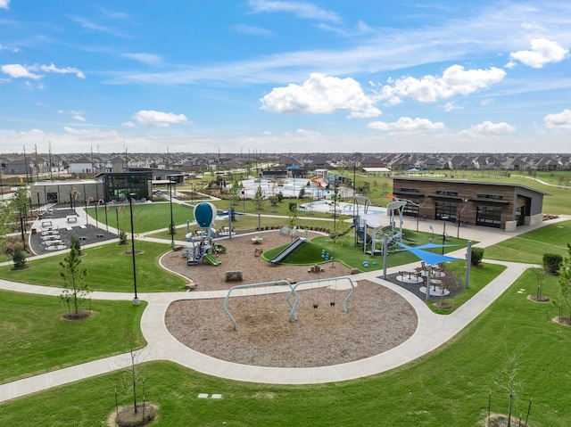 view of property's community with a lawn