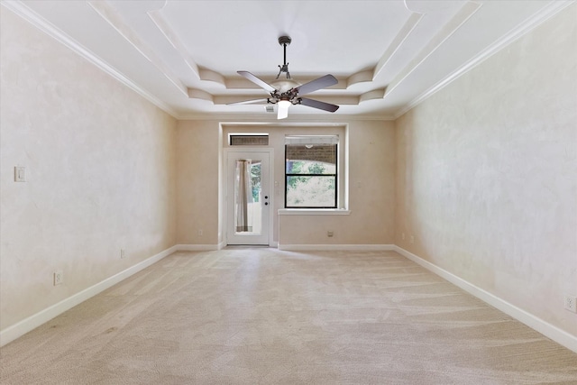 41411 Roundup Rd, Magnolia, TX 77354 - empty room with ceiling fan, crown molding, a tray ceiling, and carpet floors