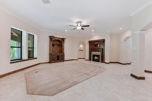 41411 Roundup Rd, Magnolia, TX 77354 - unfurnished living room with recessed lighting, arched walkways, ceiling fan, and baseboards