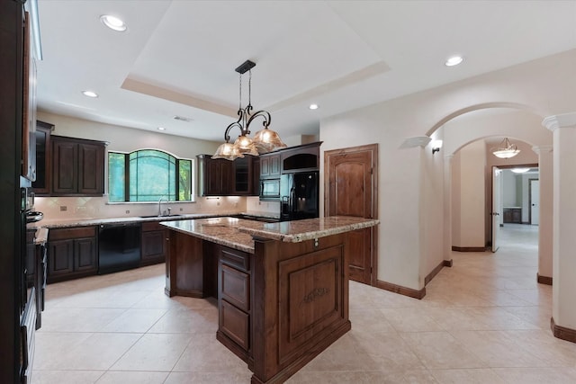 41411 Roundup Rd, Magnolia, TX 77354 - kitchen with arched walkways, ornate columns, black appliances, a sink, and a center island