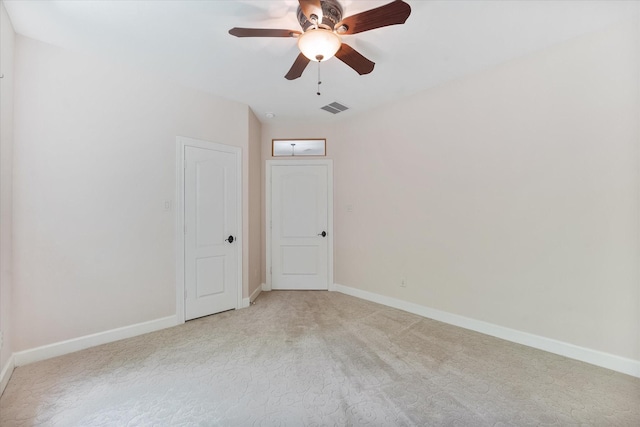41411 Roundup Rd, Magnolia, TX 77354 - empty room featuring light colored carpet, visible vents, a ceiling fan, and baseboards
