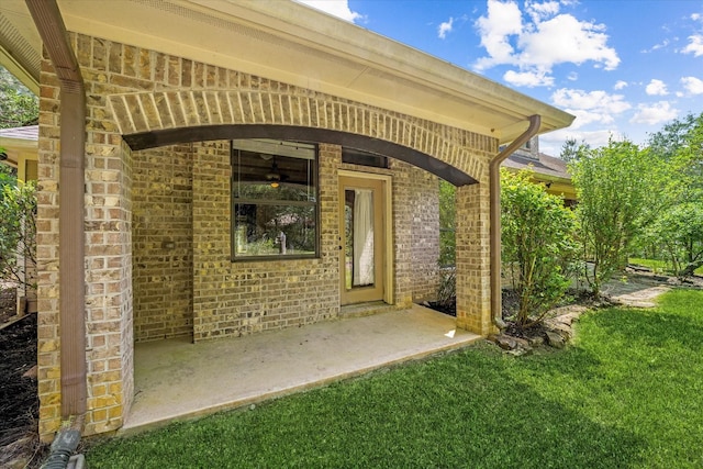 41411 Roundup Rd, Magnolia, TX 77354 - doorway to property with a yard and brick siding