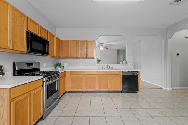 kitchen featuring a sink, black appliances, ceiling fan, light countertops, and visible vents