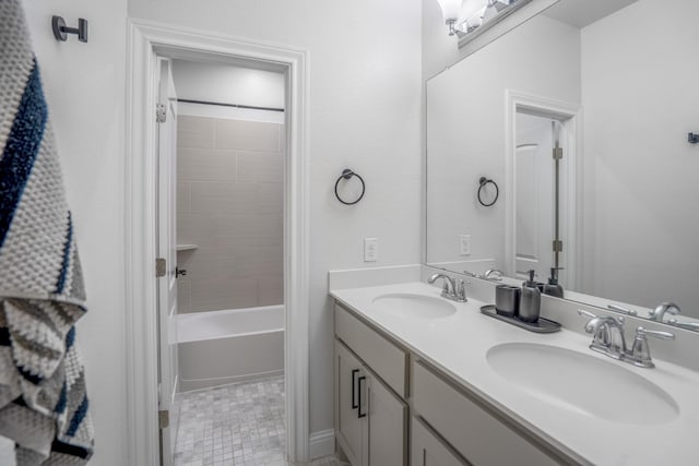 bathroom featuring a sink, tile patterned flooring, shower / tub combination, and double vanity