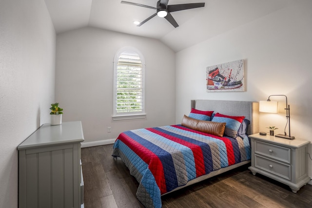 bedroom with baseboards, a ceiling fan, dark wood finished floors, and vaulted ceiling