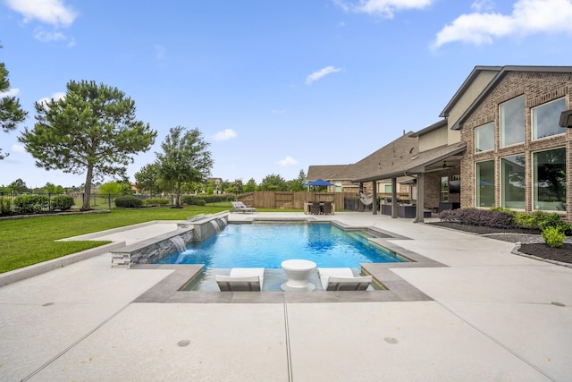 view of swimming pool featuring a lawn, a patio, a fenced in pool, and a fenced backyard