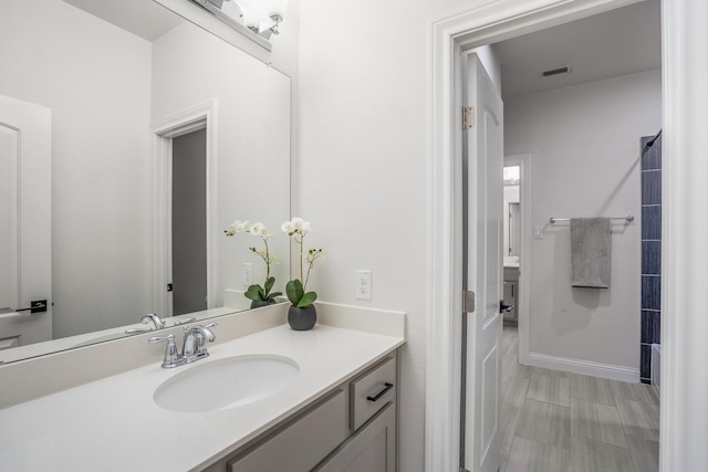 bathroom with visible vents and vanity