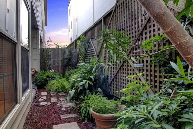property exterior at dusk with fence