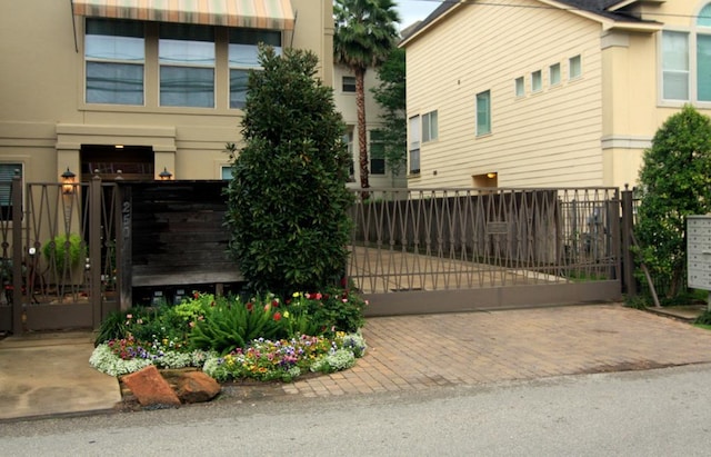 exterior space featuring a gate and a fenced front yard