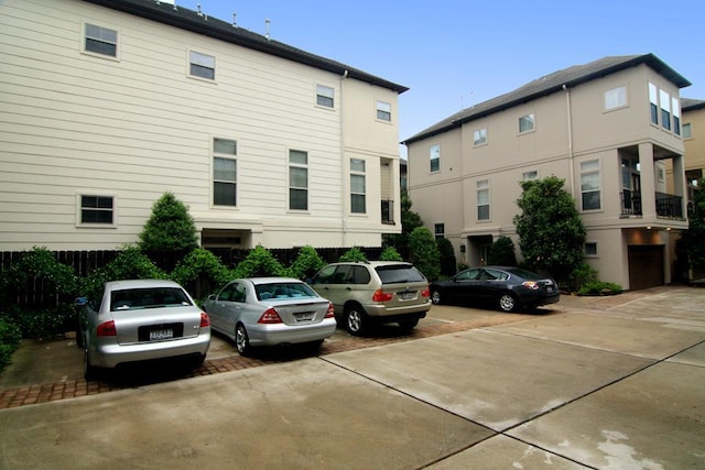 back of property with uncovered parking