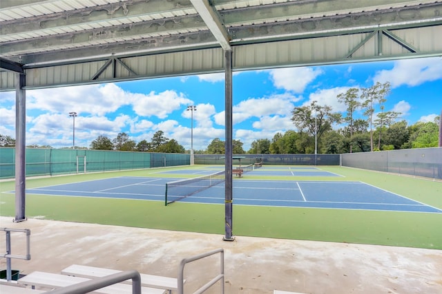 view of sport court featuring community basketball court and fence