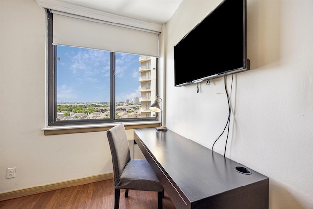 office with wood finished floors and baseboards