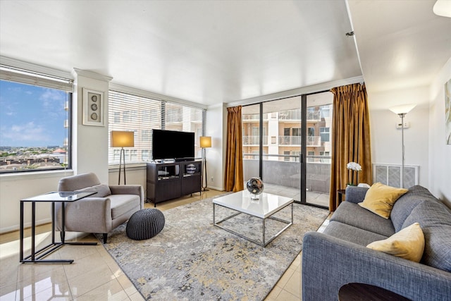 living room with plenty of natural light, visible vents, and light tile patterned floors