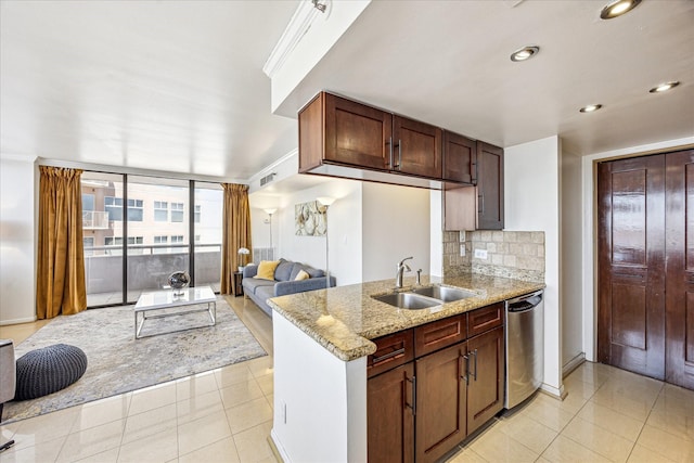 kitchen featuring light stone counters, dishwasher, visible vents, light tile patterned floors, and a sink