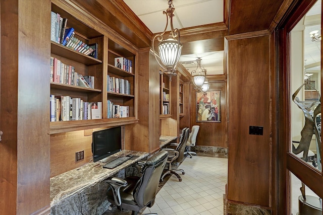 tiled home office with wood walls, crown molding, built in features, and built in desk