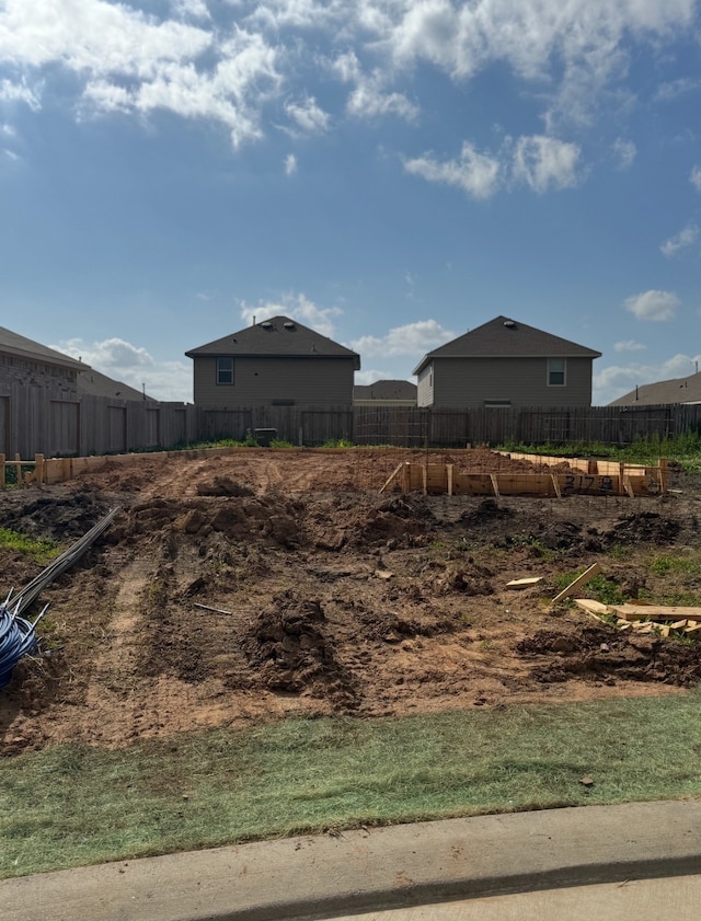 view of storm shelter featuring fence