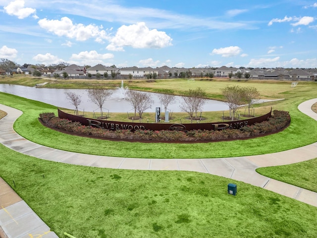 surrounding community with a yard, a residential view, and a water view