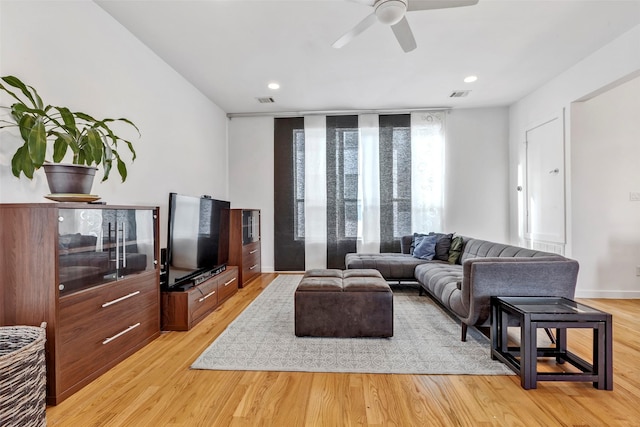 living area featuring recessed lighting, ceiling fan, light wood-type flooring, and visible vents