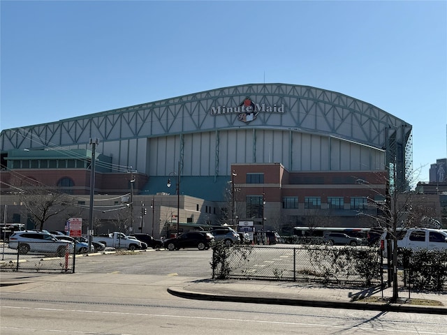 view of property featuring uncovered parking