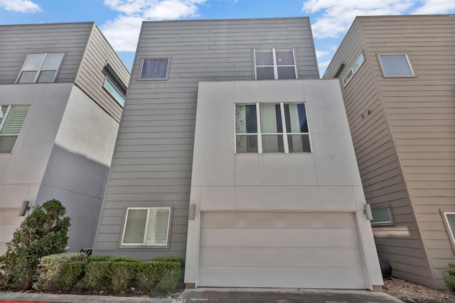 modern home with an attached garage and driveway