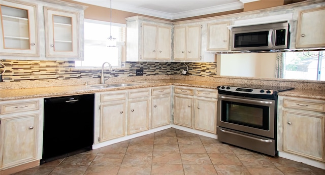 234 Fantasy Ln, Montgomery, TX 77356 - kitchen with stainless steel appliances, light brown cabinets, crown molding, tasteful backsplash, and hanging light fixtures