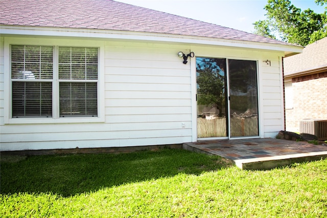 234 Fantasy Ln, Montgomery, TX 77356 - back of property with a shingled roof, a lawn, and a patio area