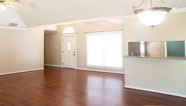 unfurnished living room with lofted ceiling, wood finished floors, ornamental molding, and healthy amount of natural light