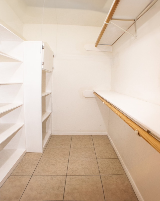 234 Fantasy Ln, Montgomery, TX 77356 - walk in closet with light tile patterned floors