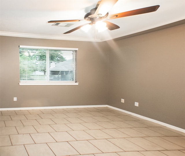 empty room with ornamental molding, a ceiling fan, and baseboards