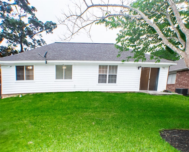234 Fantasy Ln, Montgomery, TX 77356 - rear view of property with a lawn and a shingled roof