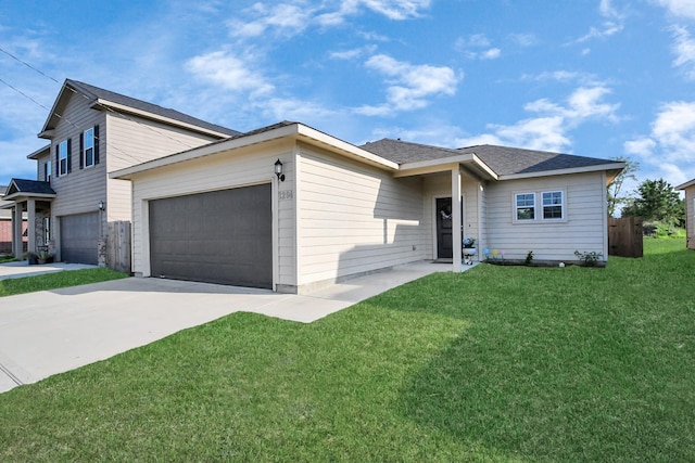 view of front of property with an attached garage, a front yard, and concrete driveway