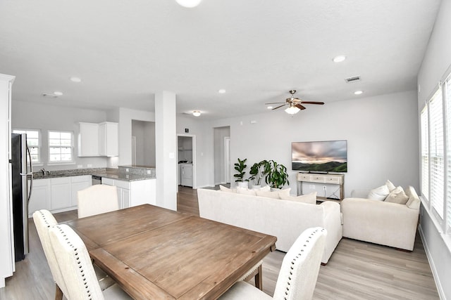 dining area with light wood-style floors, ceiling fan, and recessed lighting