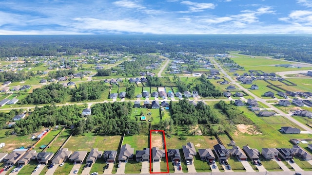 birds eye view of property with a residential view
