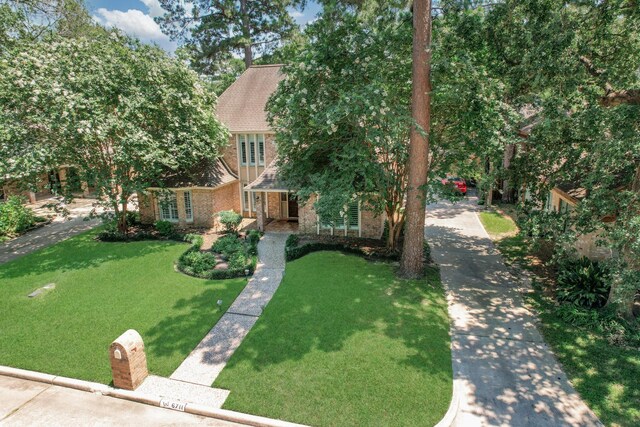 6711 Pebble Beach Dr, Houston, TX 77069 - view of front of house with brick siding and a front lawn