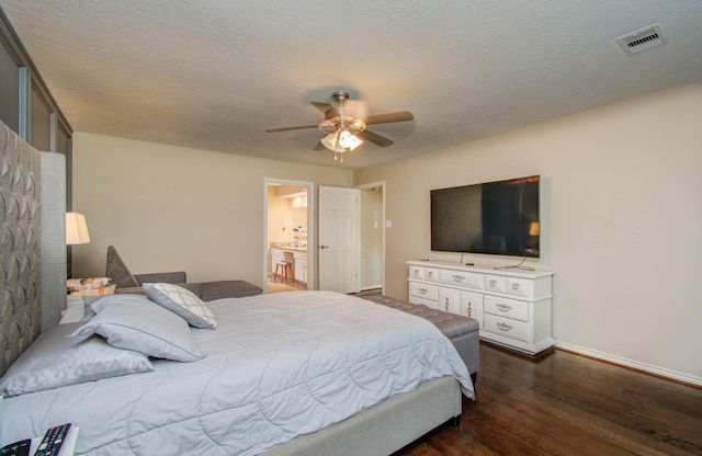 6711 Pebble Beach Dr, Houston, TX 77069 - bedroom with dark wood finished floors, baseboards, a ceiling fan, and ensuite bathroom
