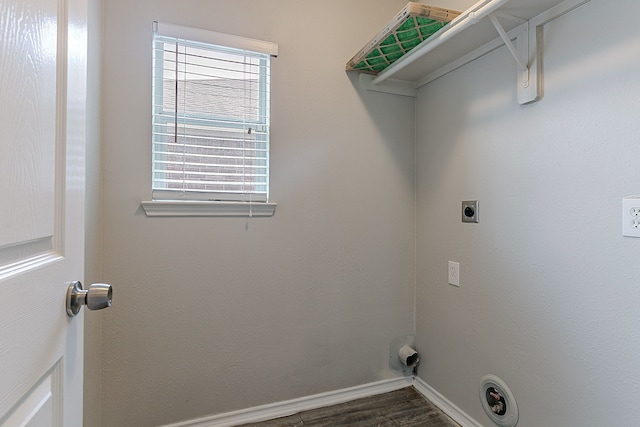 laundry room with baseboards, electric dryer hookup, wood finished floors, and laundry area