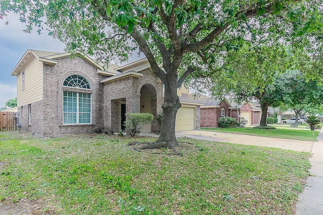 traditional home with brick siding, a front lawn, an attached garage, and concrete driveway