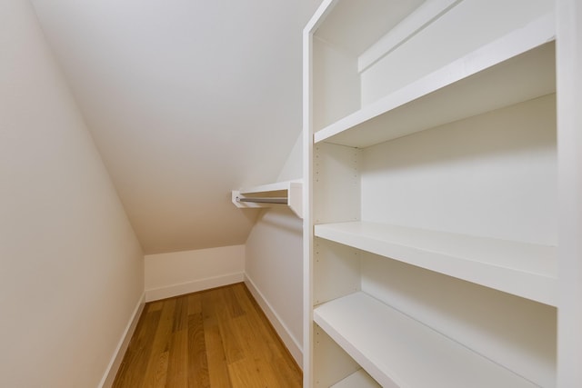 walk in closet featuring light wood-style flooring