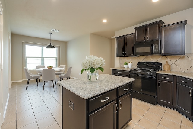 18942 W Windhaven Terrace Trl, Cypress, TX 77433 - kitchen featuring light tile patterned floors, tasteful backsplash, a kitchen island, black appliances, and recessed lighting